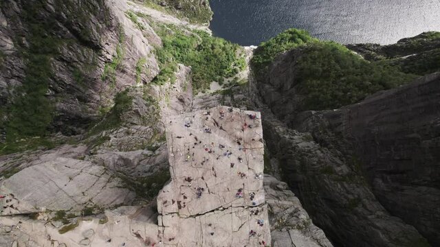Aerial of Pulpit Rock Preikestolen seen from above with tourists enjoying the beautiful view hiking in Norway 02