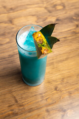 Tropical cocktails on wooden background. Frutal alcoholic cocktails.