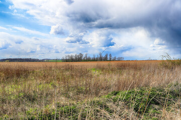 Stormy weather on the last days of april. Spring landscape with beautiful clouds.