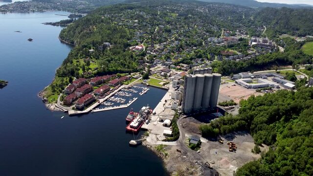 Slemmestad is a small town in the Oslofjord. Slemmestad is the home of the old Norcem concrete factory. You can see the harbor and the iconic Cement silos View from the sea.