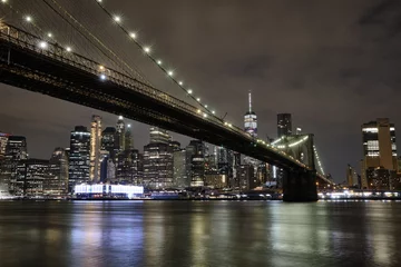 Fototapeten Brooklyn bridge as seen from the brooklyn waterfront at night © Cavan
