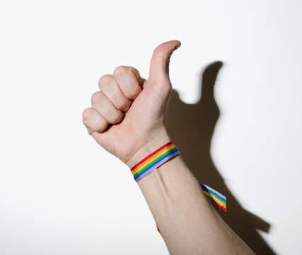 Gay man hand with rainbow bracelet great symbol