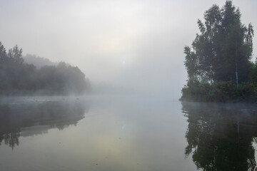 Early morning. Fog on the river. Beautiful sunrise in the summer by the river. Mystical morning on the river