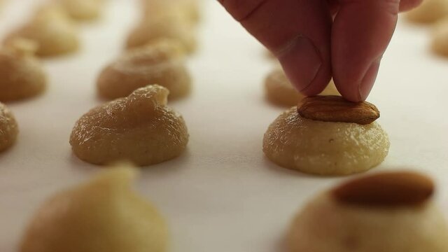 Cookie making. With Almonds. Handmade. In the kitchen. Close-up.