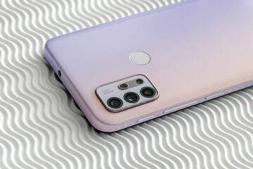 Fototapeta premium Modern Pink Smartphone Back on White Background