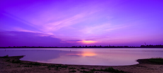 Fototapeta na wymiar A panoramic attractive background, vibrant sky and lake