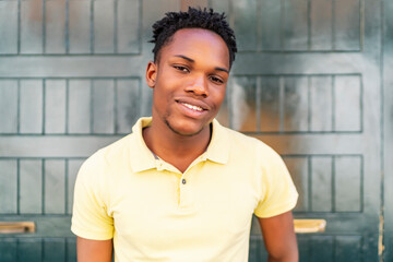 portrait of young african man smiling - Powered by Adobe