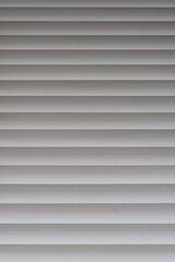 Closeup of white metal window shutter background and texture