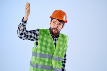 emotional man in orange hard hat construction professional Studio