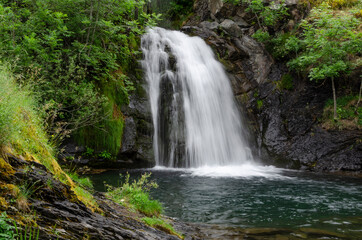 Fototapeta na wymiar El Saltón waterfall at Faro Valley in Leon, Spain.