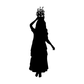 Silhouette Indian woman carries holy basil or tulasi vrindavan on her head. Indian culture and religion.
