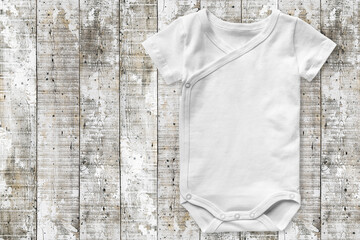 Baby bodysuit mock up white wooden background Product display