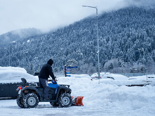 The image of the quad with the installed equipment for snow removal. © PhotoBetulo