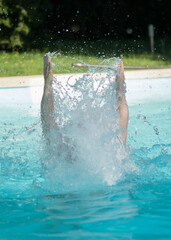 person jumping in water