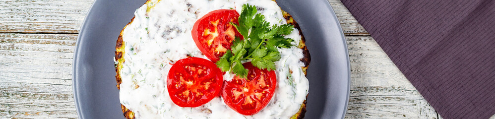 banner of Zucchini cake with tomatoes and fresh parsley on white wooden background.