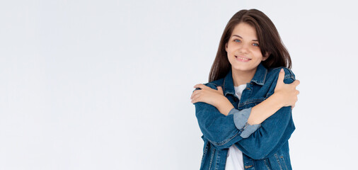 Photo of overjoyed lady good mood hands hug herself shoulders enjoy joyful soft cloth laundry...