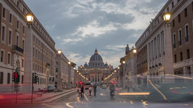 zoom in day to night timelapse from the front of Vatican City with a busy street . Famous attraction located within Rome, Italy. cityscape Vaticano, Roma, Italia.