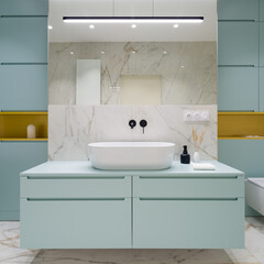 Blue furniture in elegant bathroom