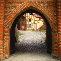 Looking through historical gate in the city wall of Tangermunde, Germany