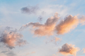 Fototapeta na wymiar Evening sky with some yellow orange , white grey and dark clouds - wide banner