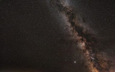 Night sky with many stars, milky way galaxy near Aquila constellation visible on right
