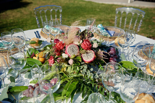 Banquet table with fresh flowers and fruits