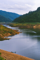 Naklejka premium A resoervoir with the mountain background at Dam Khun Dan Pra Kan Cho, Nakhonnayok, Thailand