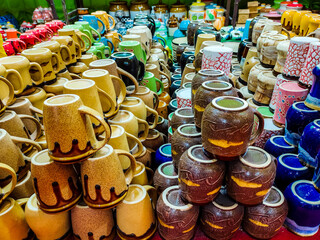 Group of cups stacked at a local market place for sale