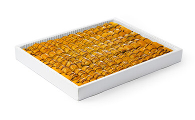 Assortment of Turkish baklava dessert in a white box isolated on white