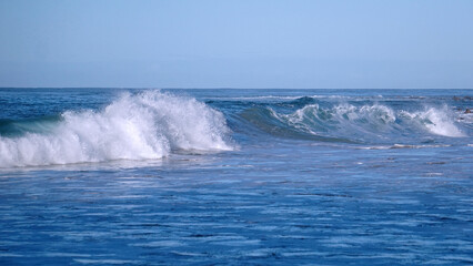 Breaking waves in the Pacific Ocean off the coast of Kauai