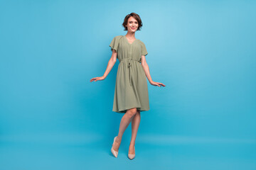 Full length photo of nice millennial brunette lady wear khaki dress stilettos isolated on blue...