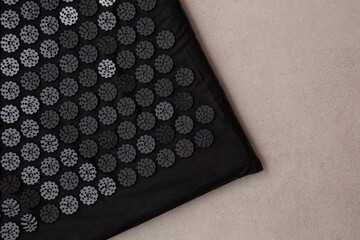 Acupuncture mat with many plastic spikes. Alternative therapy and relaxation remedy