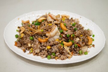 Asian food black olive fried rice  with cashew and shrimp healthy meal nutrition cooking traditional food