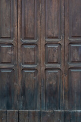 Old antique wooden door worked by hand