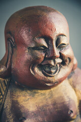 Fototapeta na wymiar Tradional wooden statue of chinese Buddha