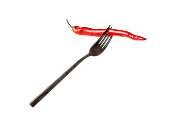 Red hot chili peppers on a fork isolated on a white background. Spicy food concept.