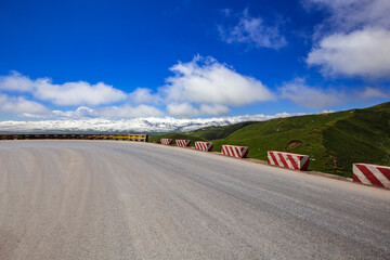 Tarmac road under blue sky