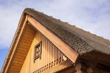 Fototapeta na wymiar Thatched or reed roof of a traditional Belarusian house.