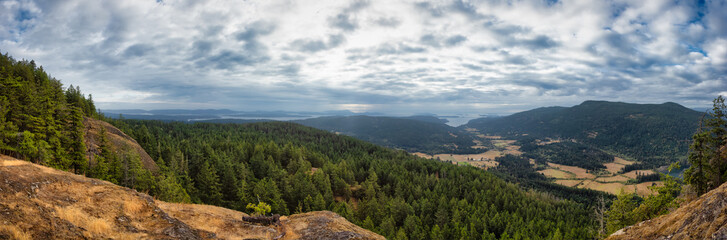 Panoramic View of Salt Spring Island and farms from the top of Mt. Maxwell. Cloudy Summer Morning. Gulf Islands, British Columbia, Canada. Canadian Nature Background
