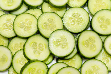 Fresh Green Cucumber and slices nice background.