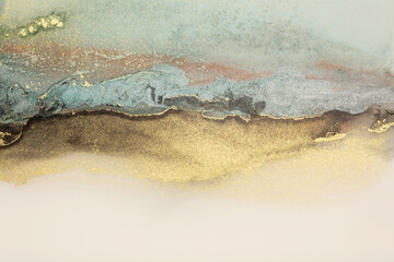 Art Abstract smoke painting blots horizontal background. Alcohol ink blue, beige and gold colors. Marble texture.