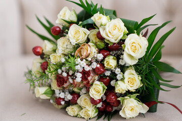 Charmingly beautiful wedding bouquet of fragrant flowers