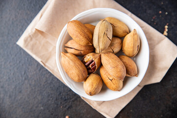 pecan nut fresh portion ready to eat meal snack on the table copy space food background rustic. top view keto or paleo diet veggie vegan or vegetarian food