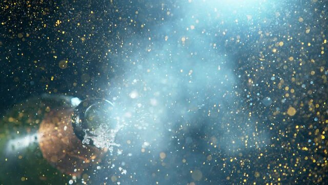 Super slow motion of Champagne explosion with glittering particles. Filmed on high speed cinema camera, 1000fps