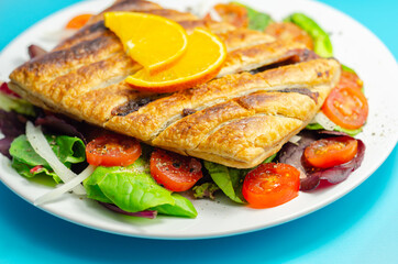 Tasty steak slice, british steak with sauce, potato and leek, wrapped in puff pastry