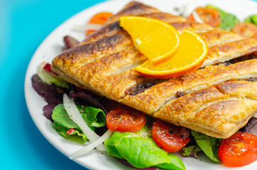Tasty steak slice, british steak with sauce, potato and leek, wrapped in puff pastry