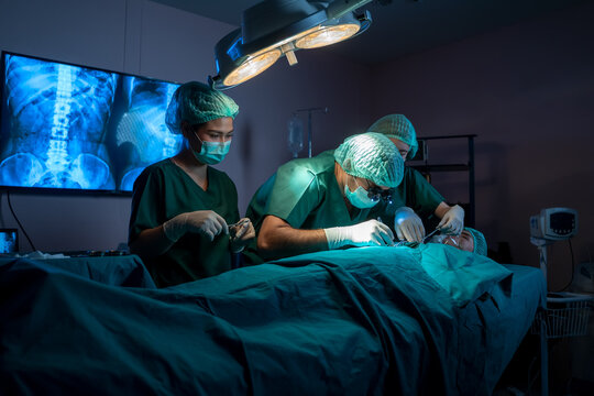 Group doctor surgeon performing surgical operation