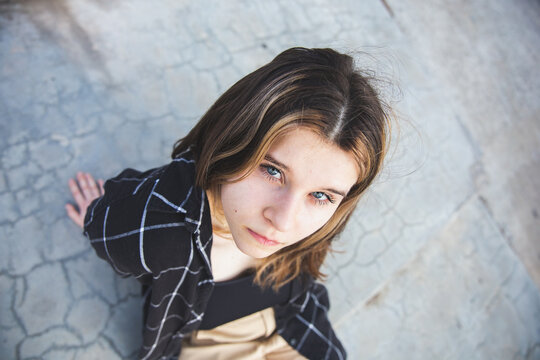 Portrait of a teenage girl with blue eyes and dyed hair