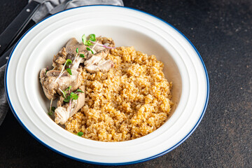 wheat or quinoa chicken, porridge with boiled  meat, healthy food fresh portion ready to eat meal snack on the table copy space food background rustic. top view keto or paleo diet