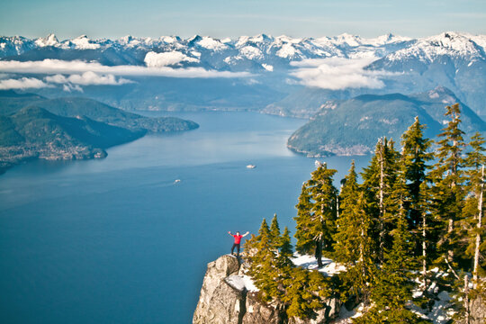 Man standing on cliff at Saint Marks Summit, Vancouver, B.C.